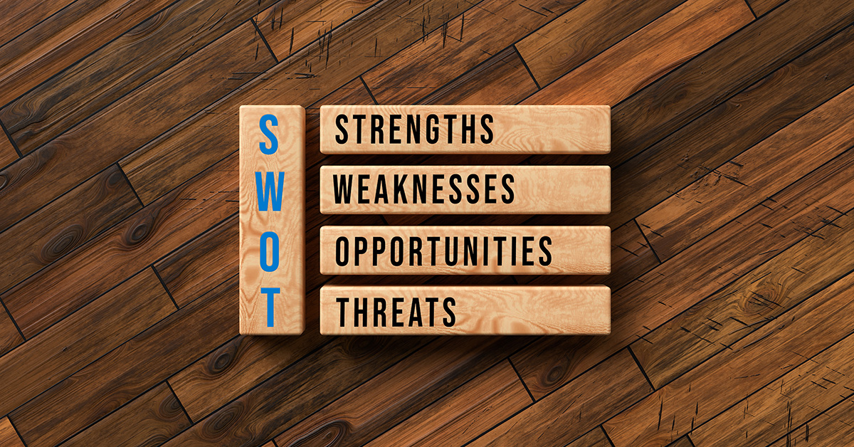 Wooden blocks marked "Strengths, Weaknesses, Opportunities, and Threats"